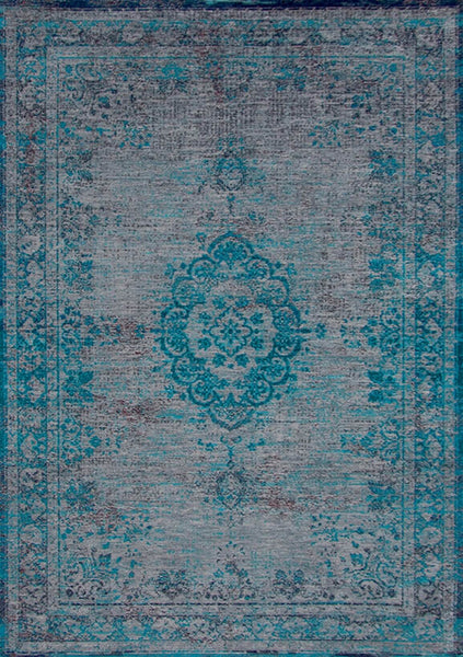 A Truly Vintage look Medallion Large flatweave rug in Turquoise from The Fading World collection by Louis De Poortere